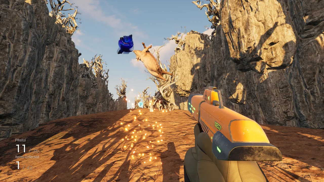 First-person view holding the Pihstol as a hit pih flips through the air, dropping a blue collectible; the HUD shows ammo and an "Items Collected 1/42" counter