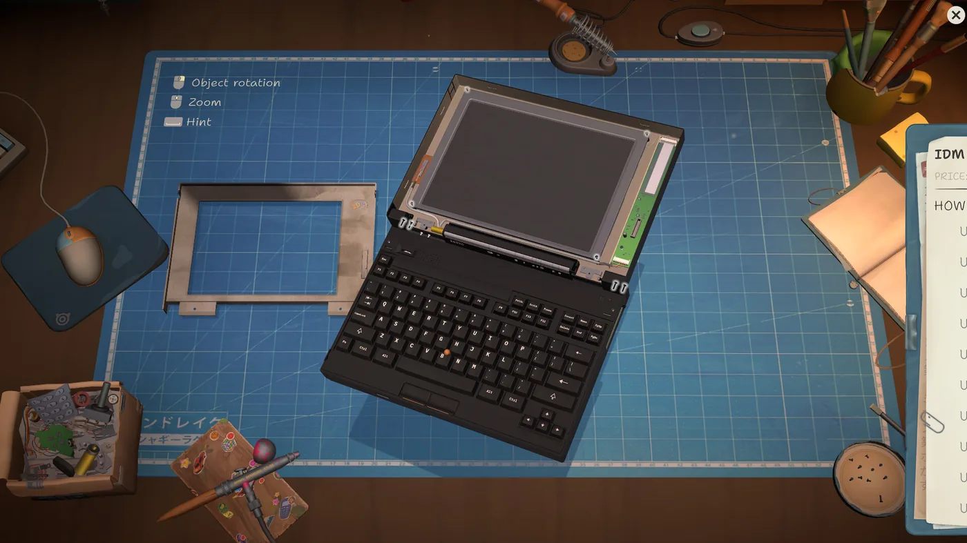 A disassembled laptop on the cutting mat, its screen bezel removed and set aside, with the on-screen control legend and the order's to-do list visible