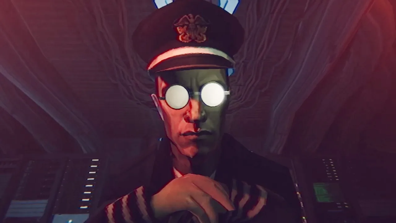 The captain in close-up under red alert lighting, face lit from below